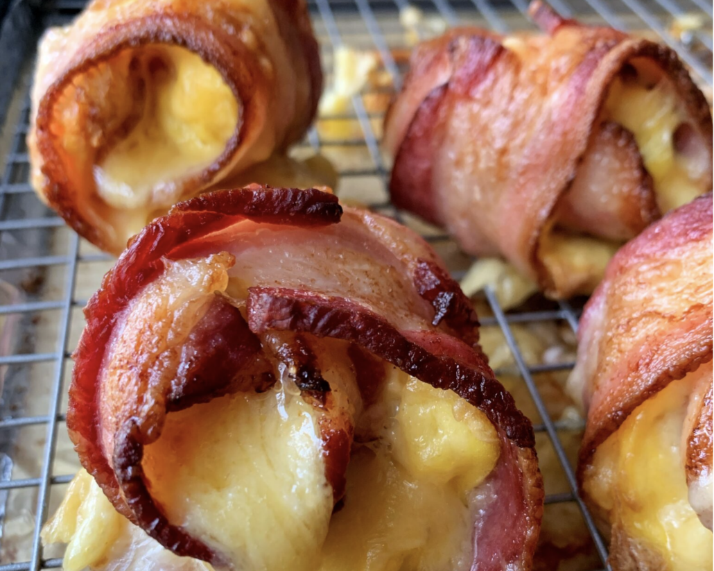 close up of bacon wrapped around eggs and cheese